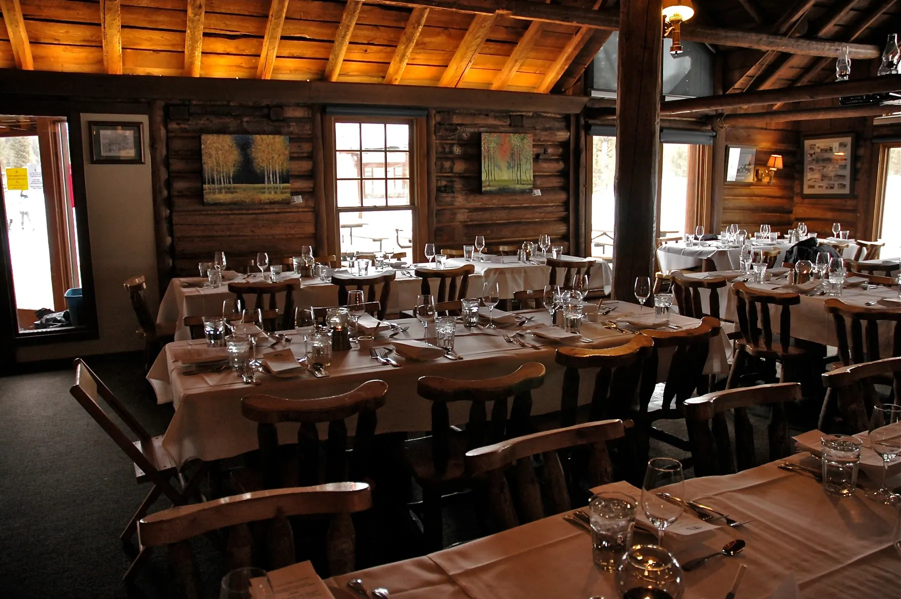 The log dining room set for a winter dinner