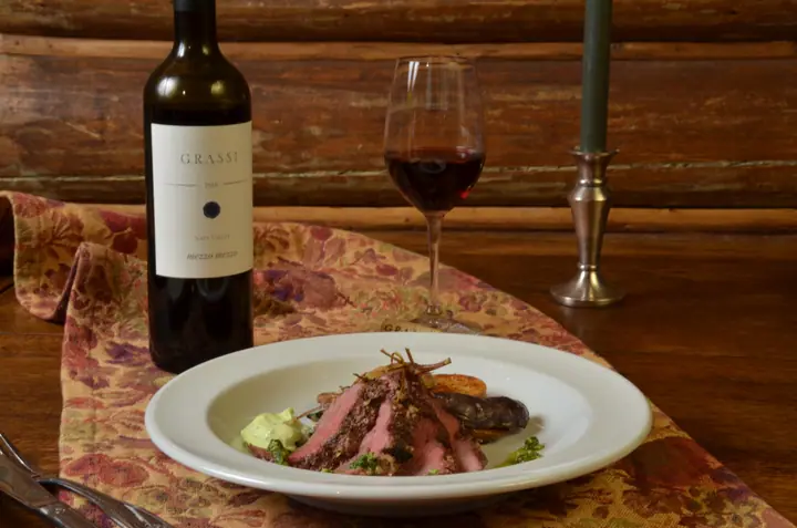Steak with a glass of Grassi red